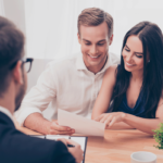 Happy Couple Looking at their Tax Return