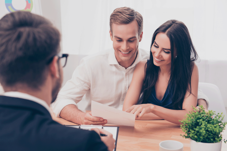 Happy Couple Looking at their Tax Return